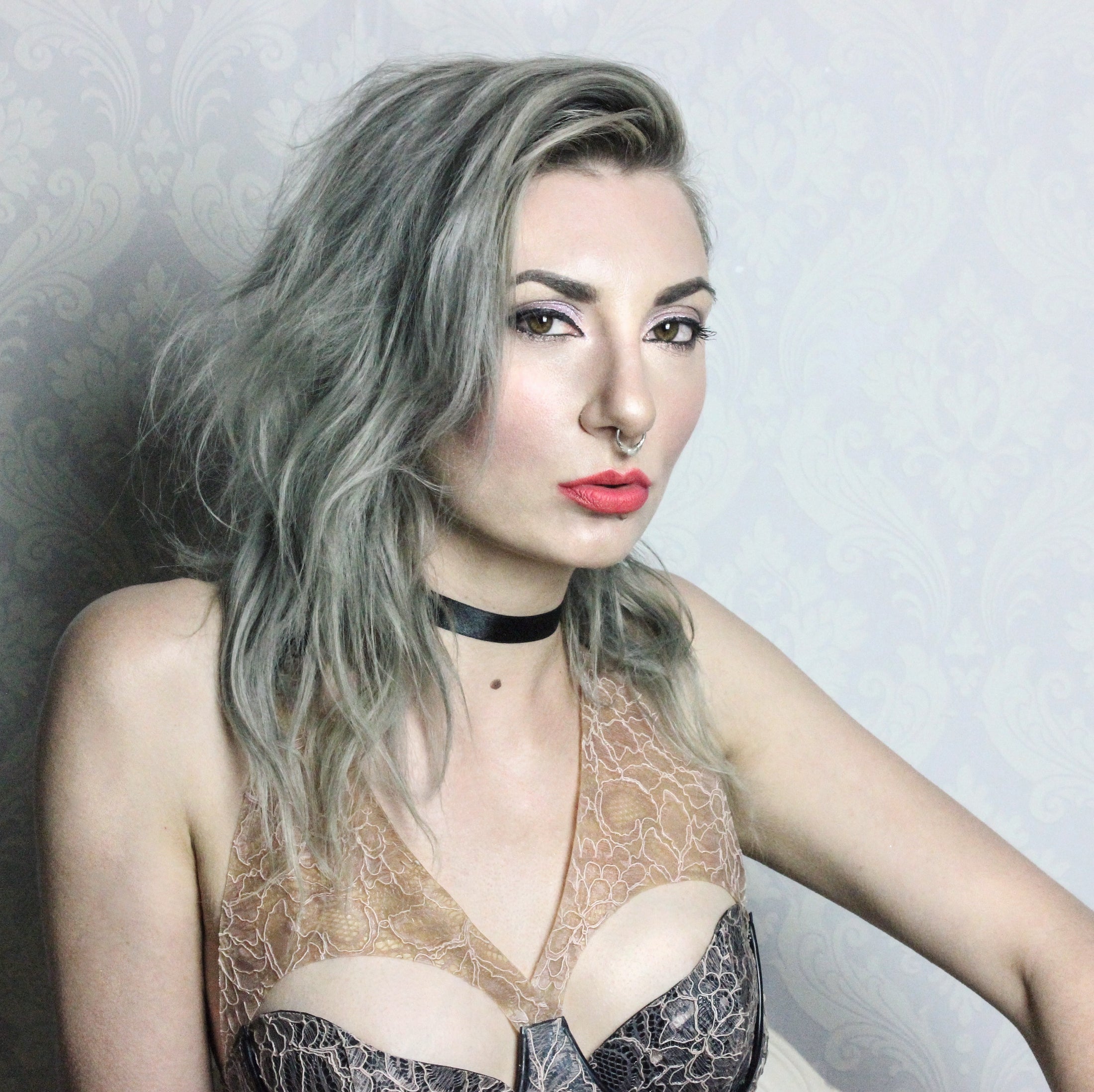 Detail of the black strapping and cup shaping on the Aurora latex-lace bra
