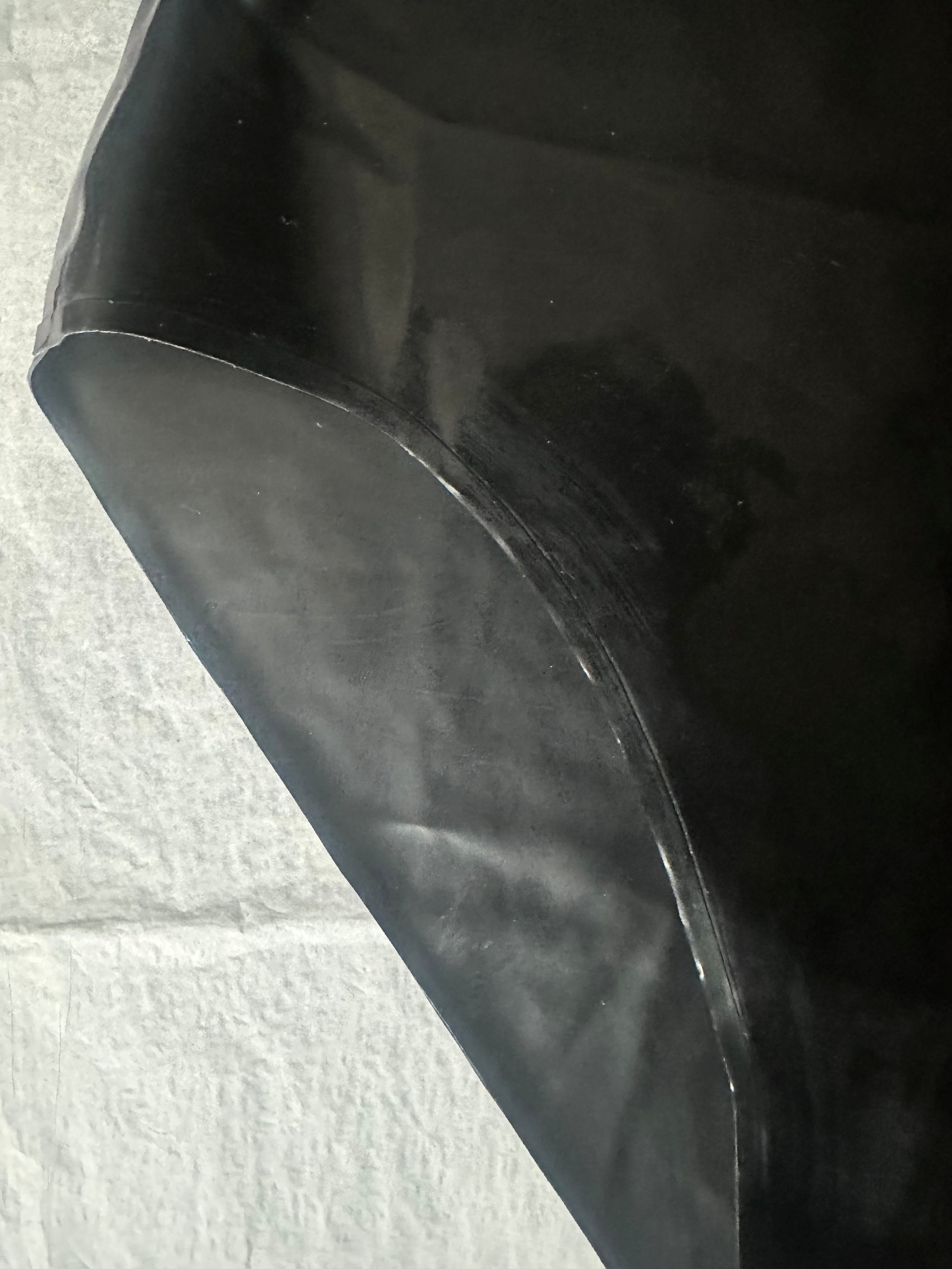 Styling of the high waisted black latex briefs with high leg fit