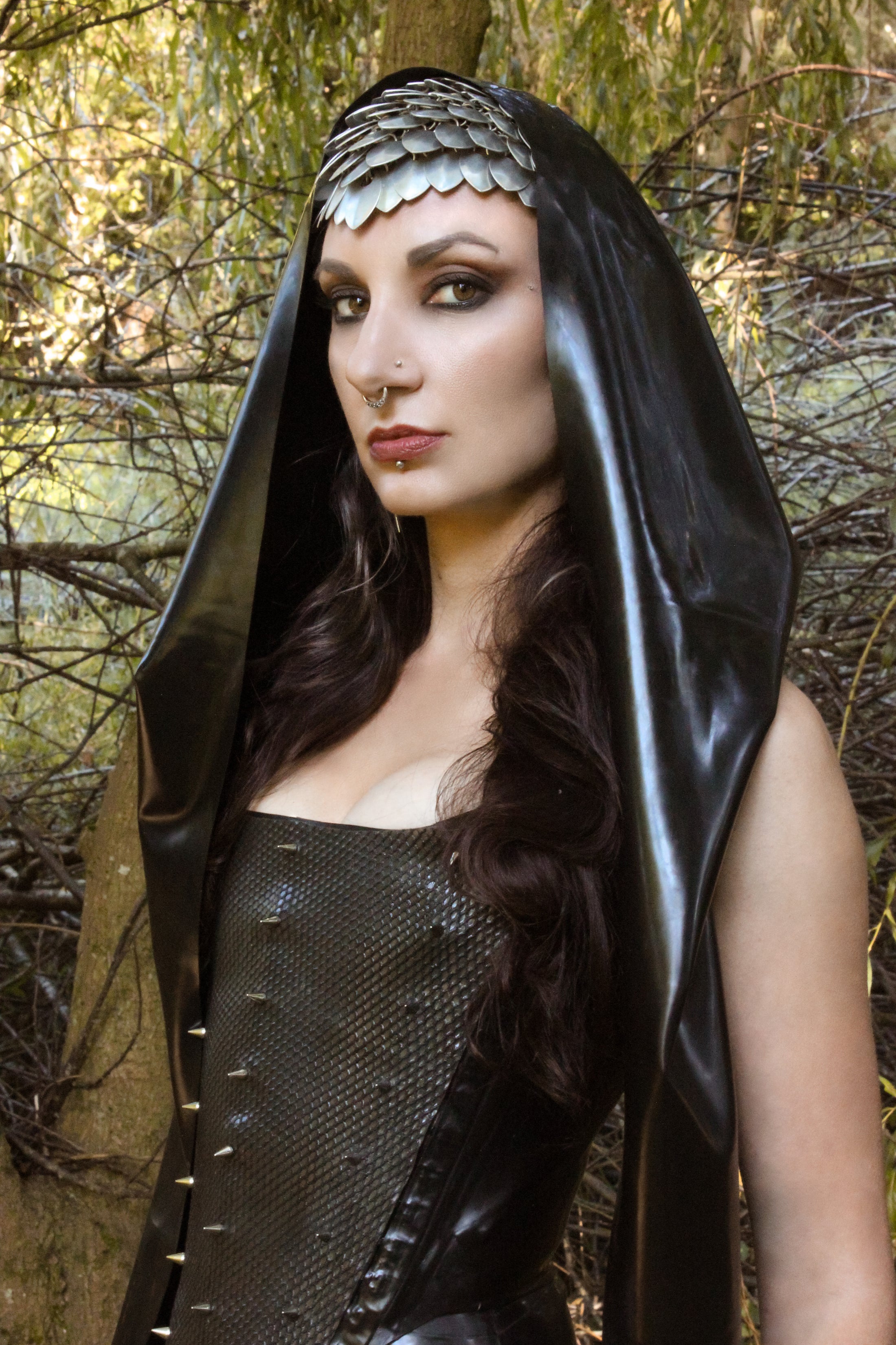 Styling of the latex wrap hood with dramatic long wrapping sides