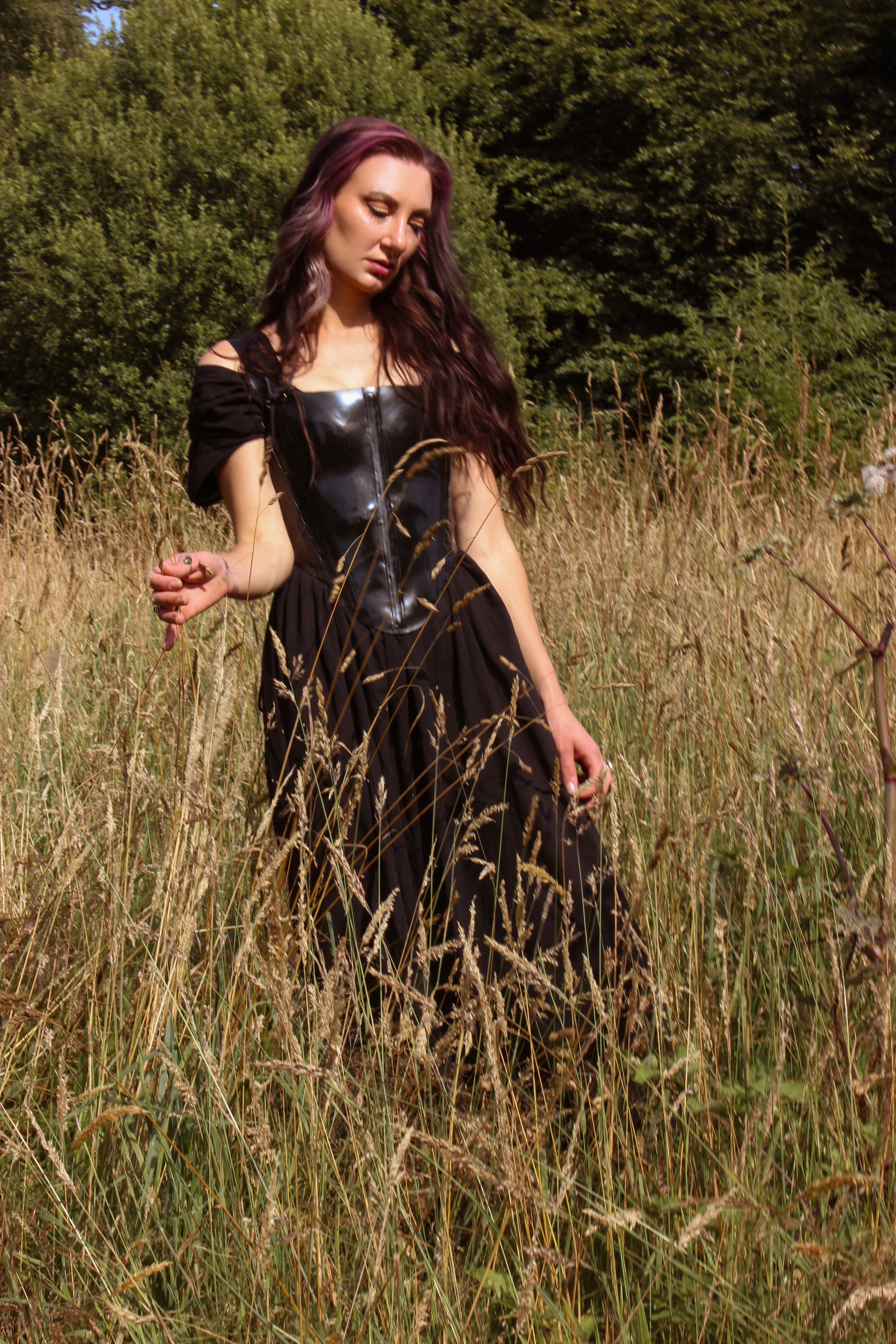 Close detail of the centre-back eyelet closure on the Elizabethan latex corset