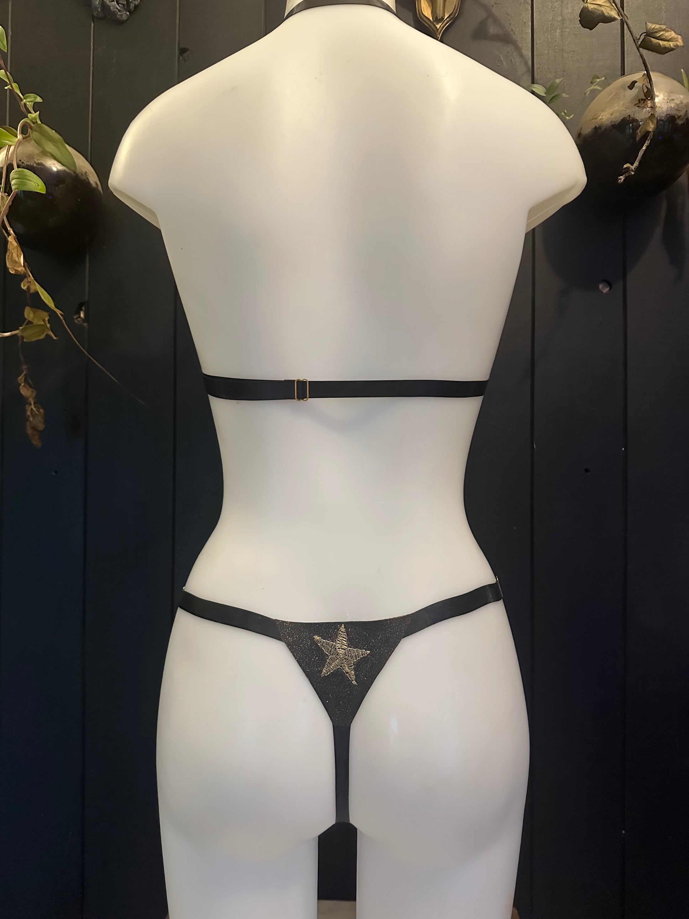 Texture detail of the celestial glitter-mesh latex finish on the adjustable bikini