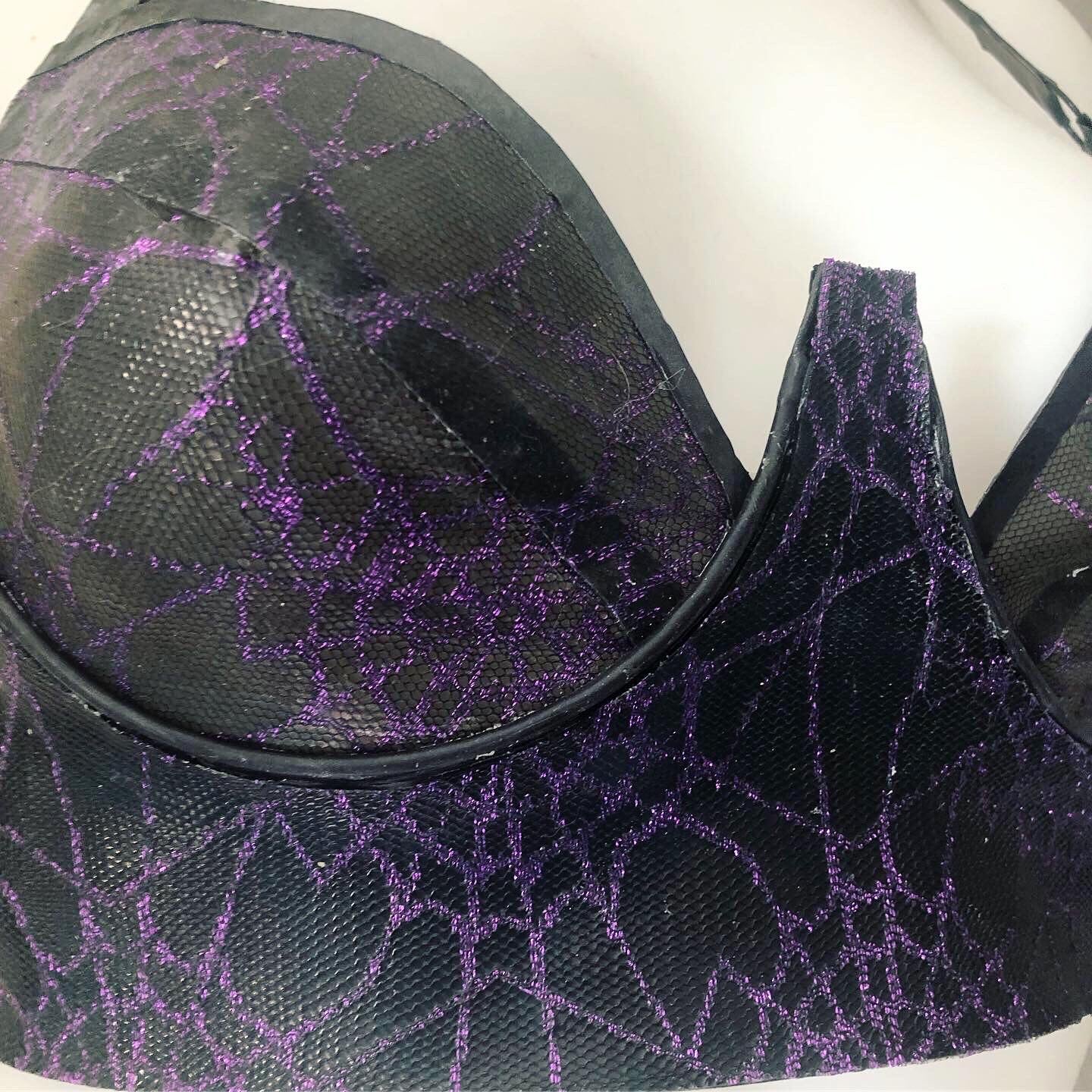 Texture detail of the spiderweb mesh on the latex plunge bra
