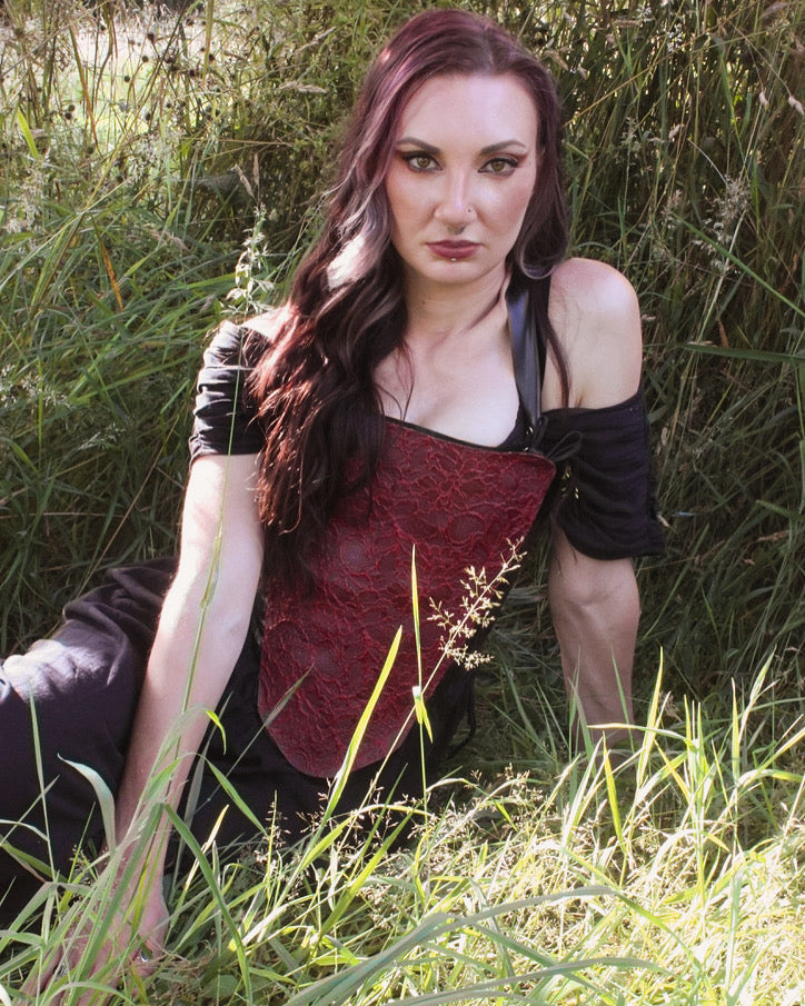 Close detail of the hook and eye tape on the latex-lace corset panel