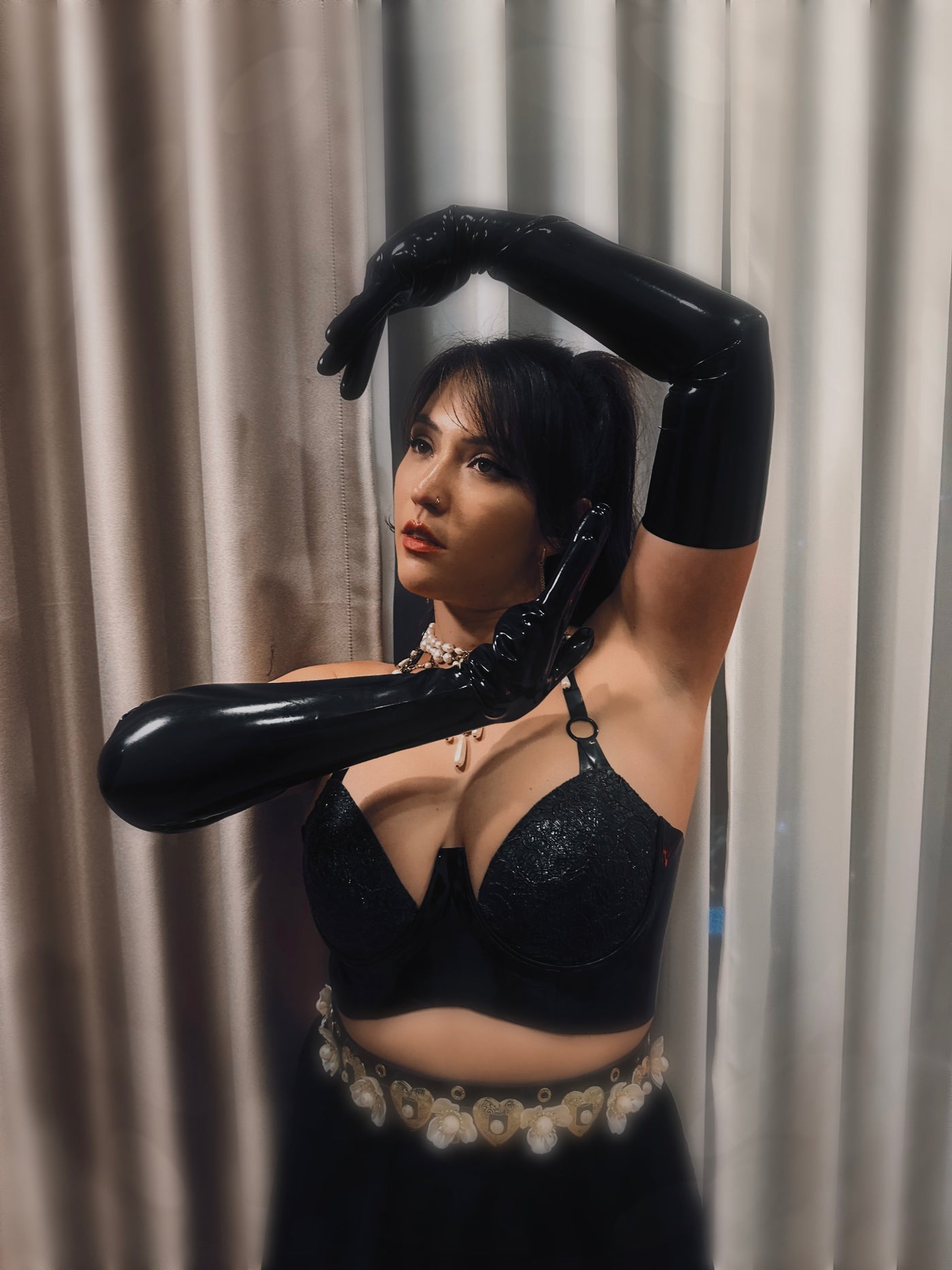 Styling of the latex-lace plunge halter bra worn as outerwear