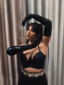 Styling of the latex-lace plunge halter bra worn as outerwear