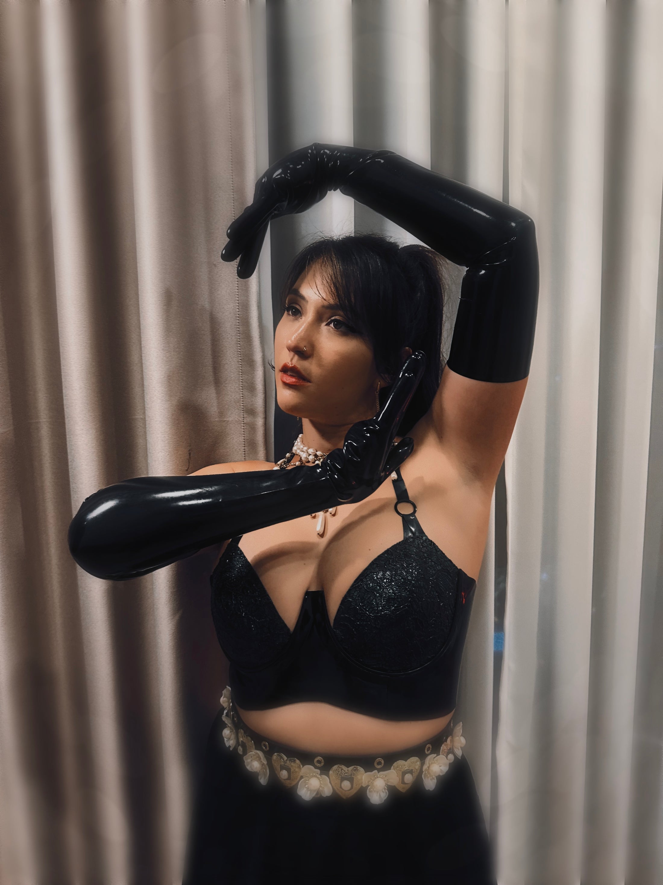 Styling of the latex-lace plunge halter bra worn as outerwear