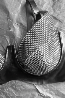 Detail of the halter strap and net cups on the latex plunge bra