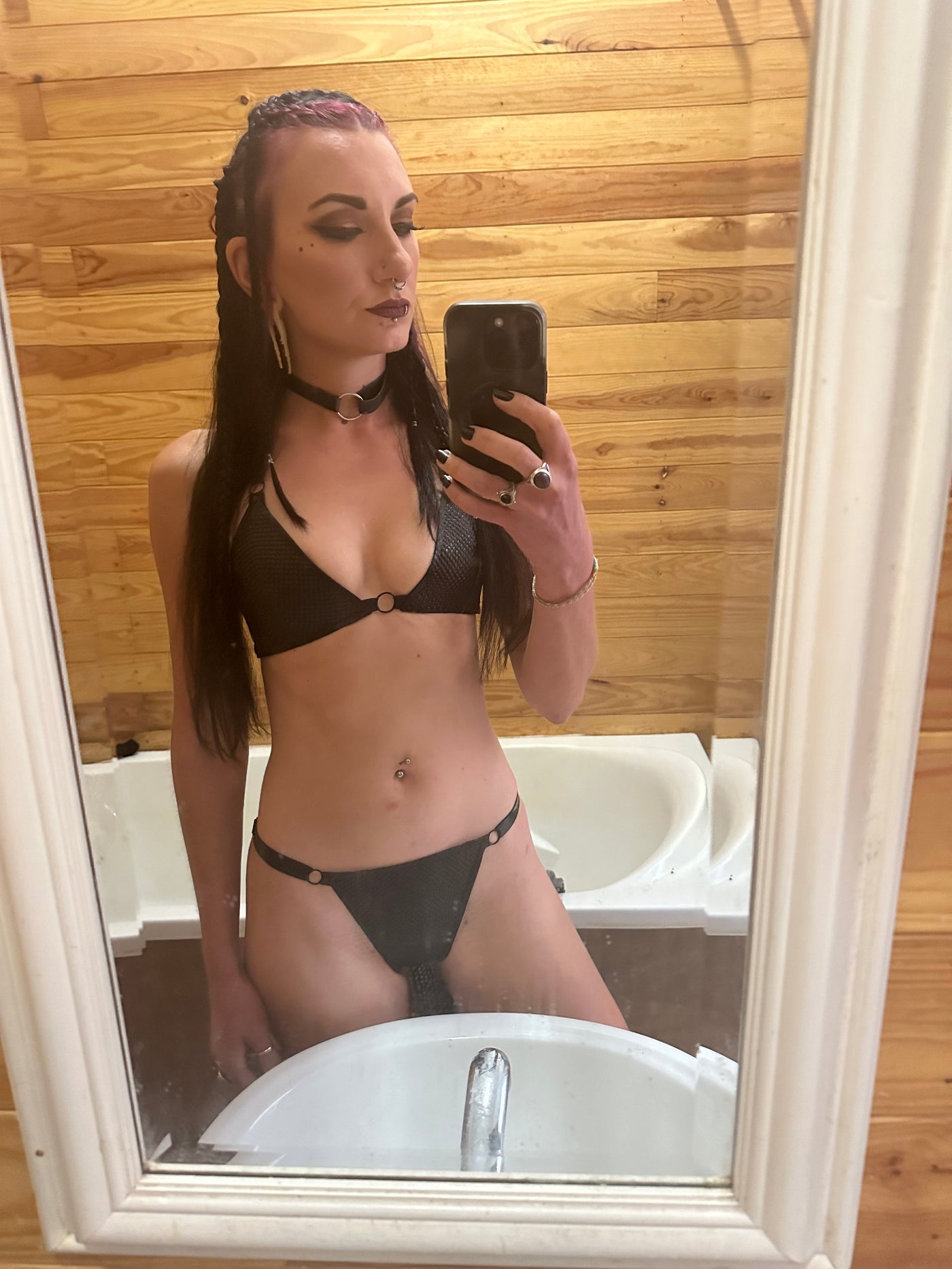 Close detail of the adjustable straps on the latex-net bikini top