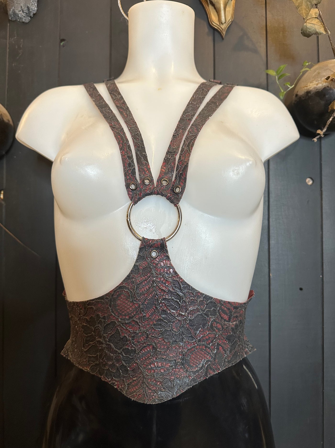 Eustratia latex-lace cinched harness sample in midnight on plum with adjustable straps, size small