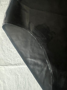 Styling of the high waisted black latex briefs with high leg fit