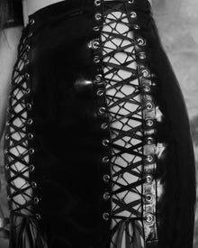 Fit detail of the long panelled Lilith lace-up latex skirt on the body