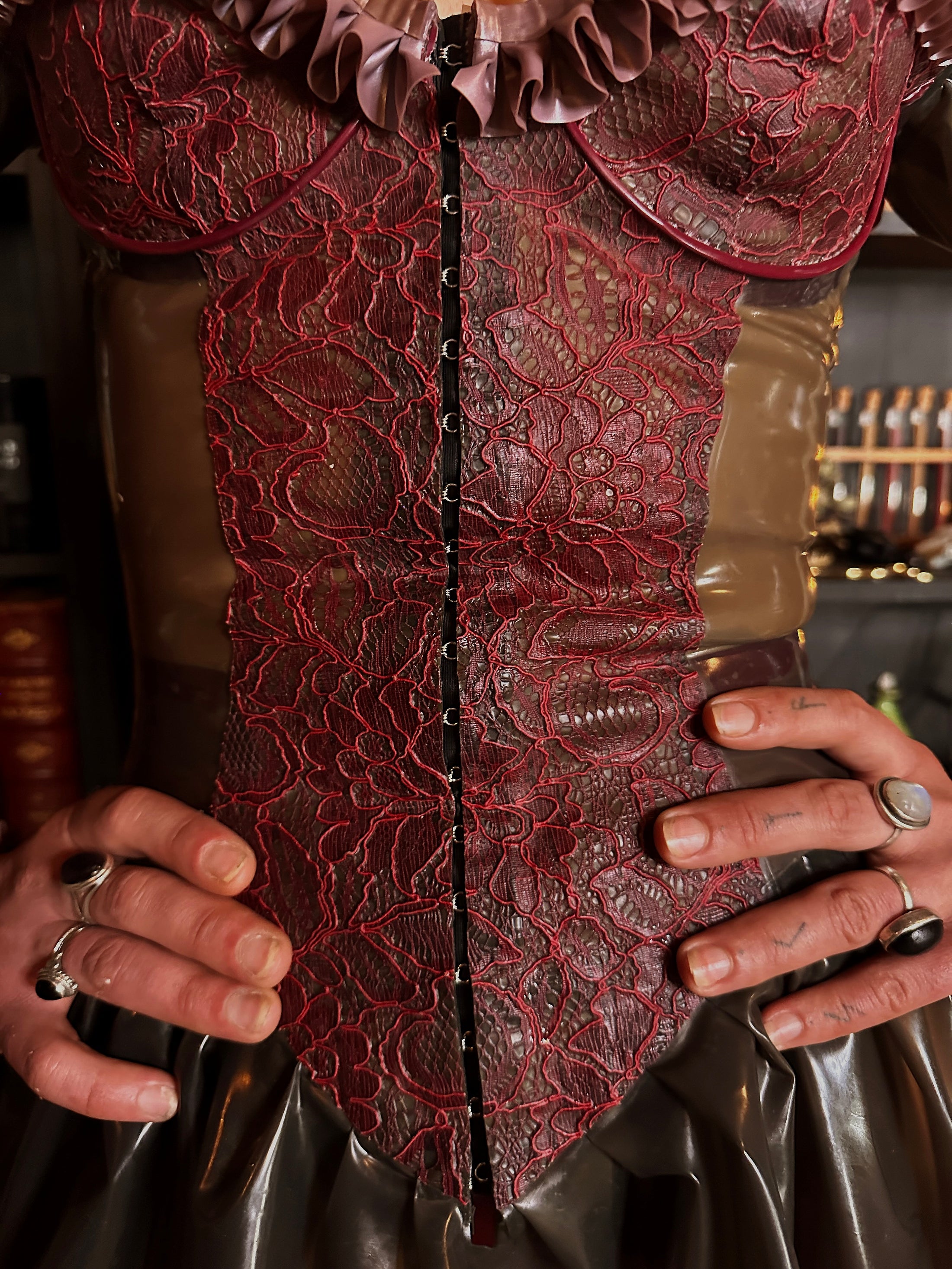 Fit detail of the waist-cinching contoured Spring latex dress