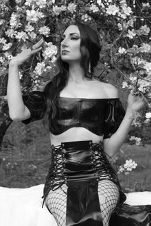 Styling detail of the regal Justice puff-sleeved latex cropped top