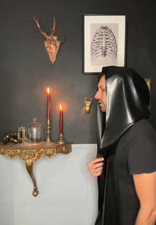 Detail of the long wrappable sides on the one-size unisex latex hood