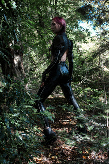 Texture detail of the premium vegan latex on the zipper leggings