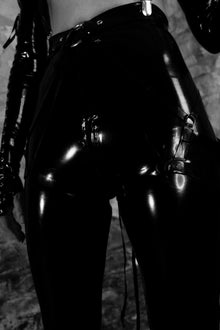 Styling of the polished fetish-inspired latex zipper leggings