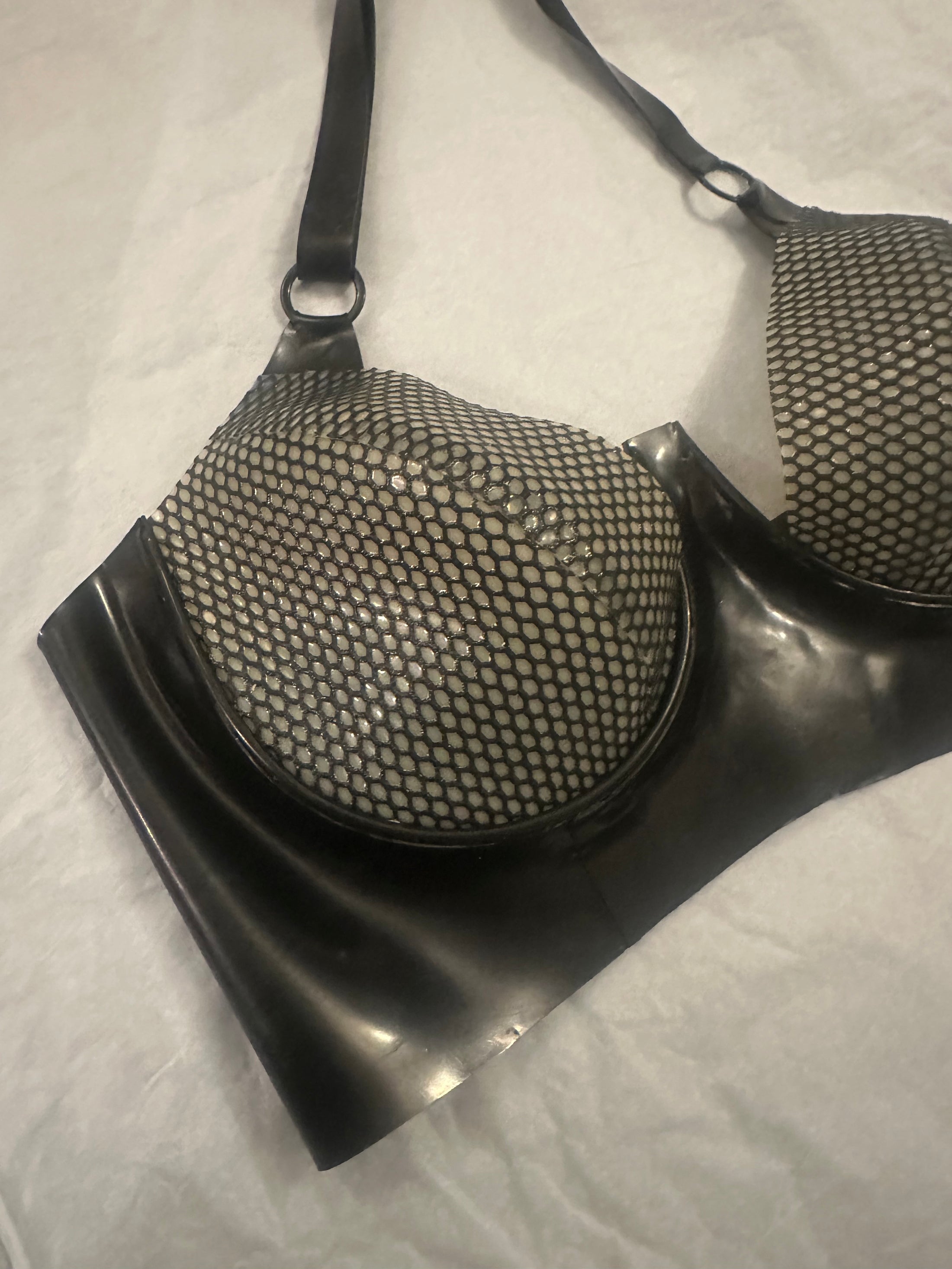 Styling of the plunge latex-net bra showing the textured net finish