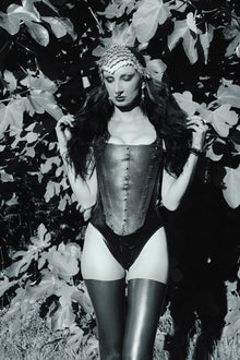 Styling of the spiked latex-net panel attached to the Elizabethan corset