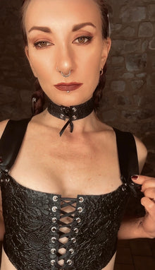 Styling of the latex-lace corset top with satin ribbon front lacing