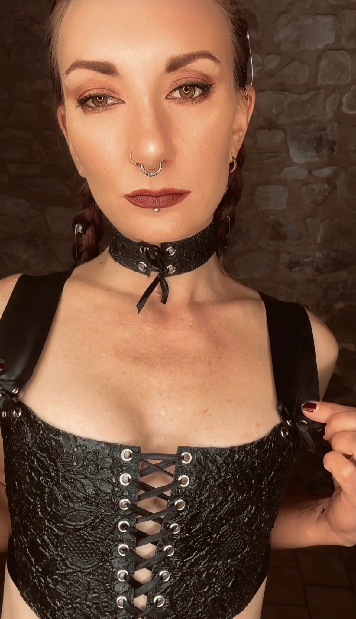 Styling of the latex-lace corset top with satin ribbon front lacing