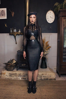 Detail of the textured latex-lace pattern on the beret crown