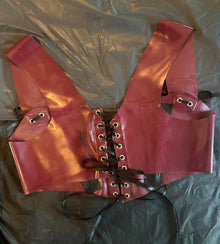 Close detail of the boning on the front of the cropped latex corset top