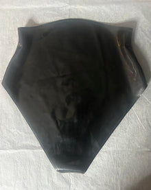 Close detail of the high leg cut and slim trim on the black latex briefs