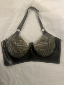 Texture detail of the signature latex-net on the push-up plunge bra
