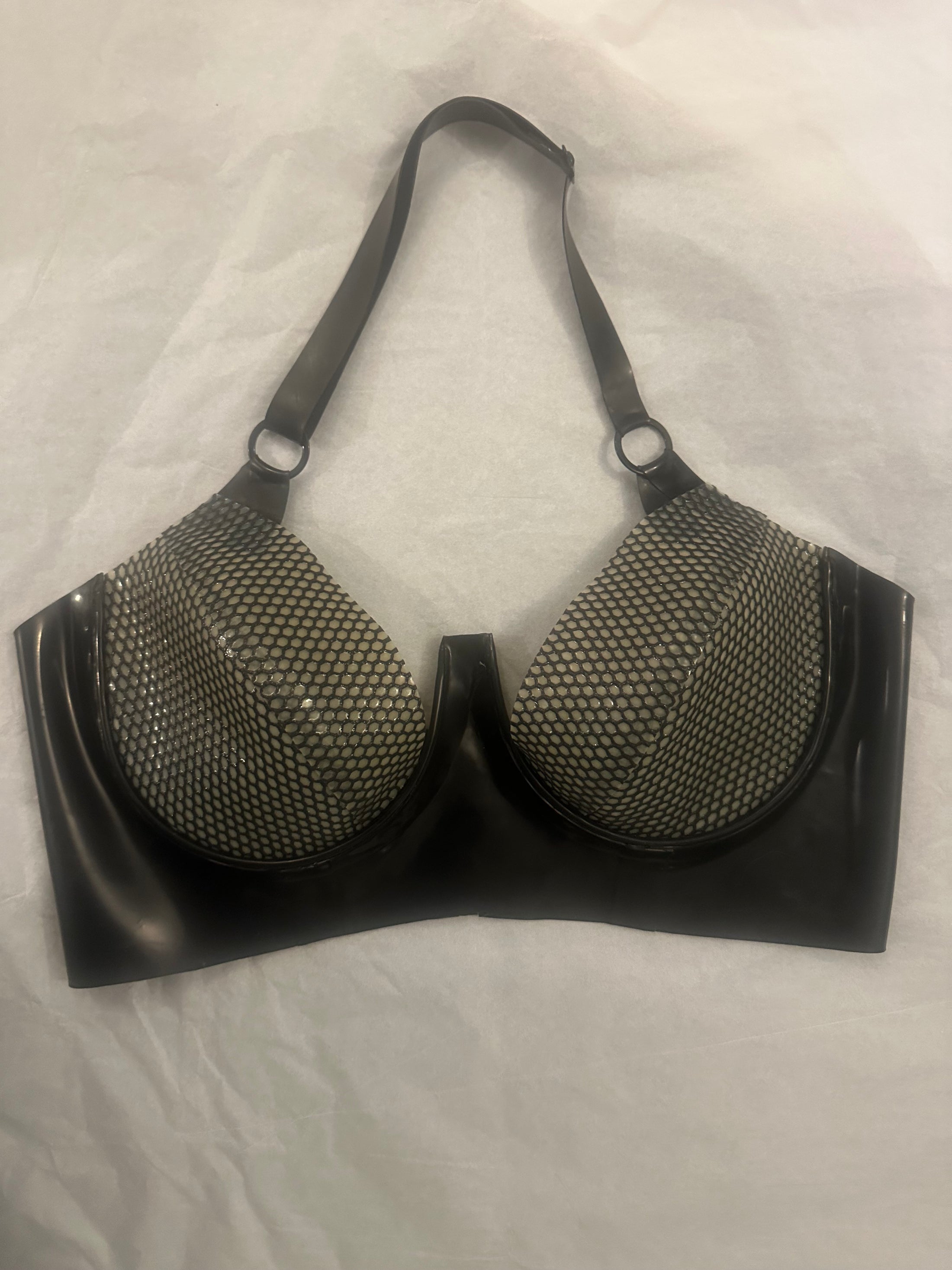 Texture detail of the signature latex-net on the push-up plunge bra
