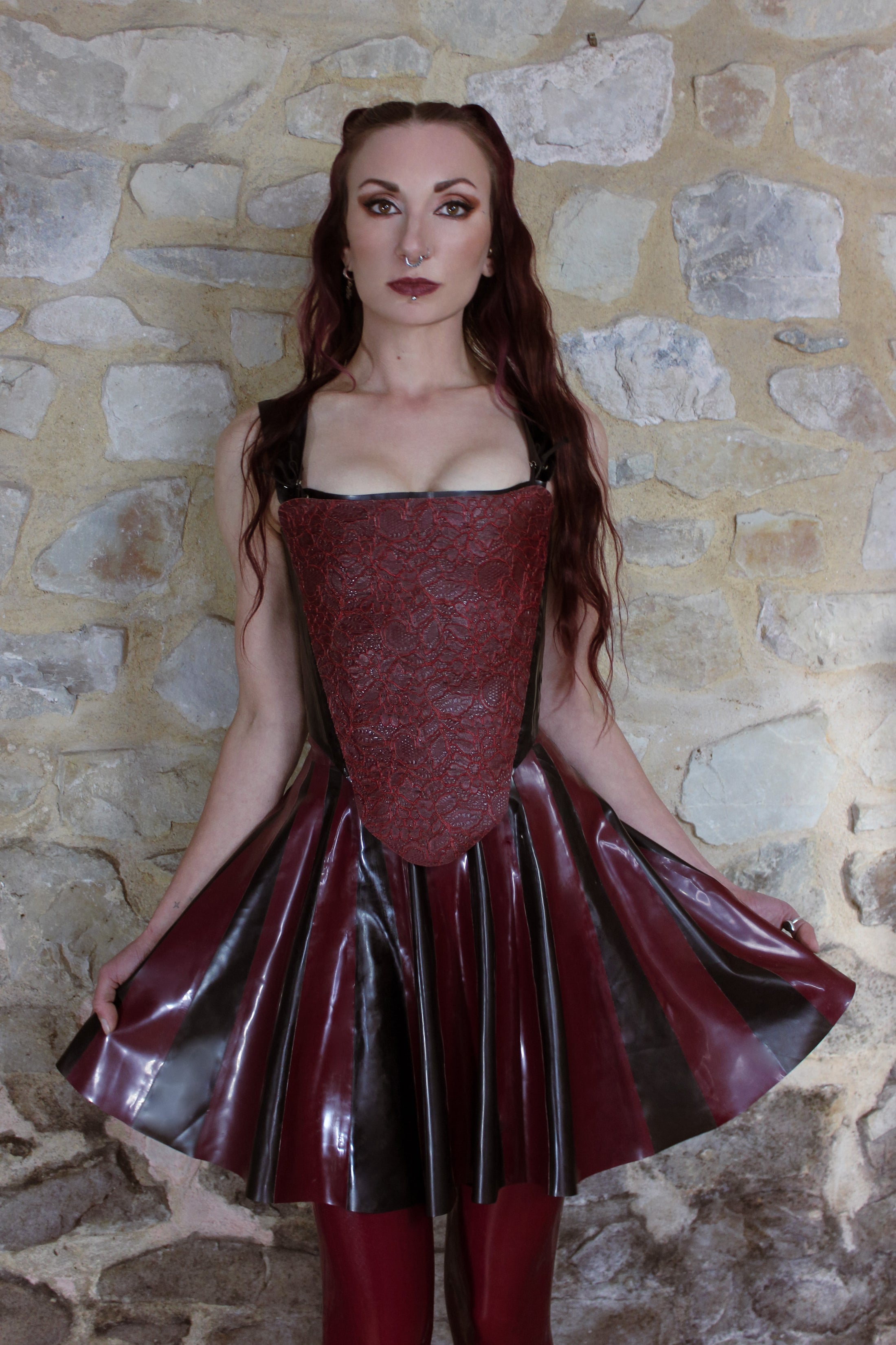 Close detail of the two-tone striped design on the latex skater skirt