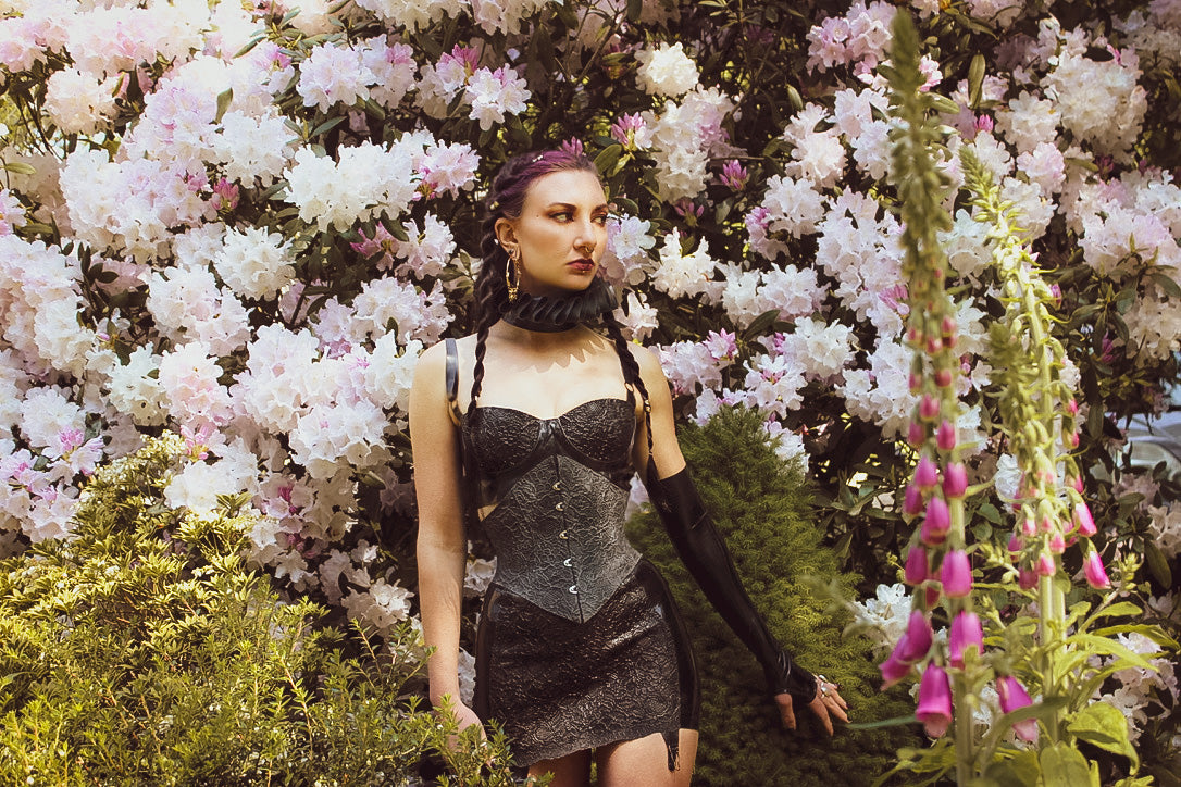 Styling detail of the eyeletted back on the latex-lace textured corset