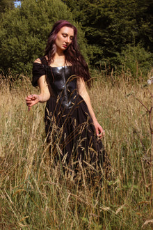 Close detail of the centre-back eyelet closure on the Elizabethan latex corset