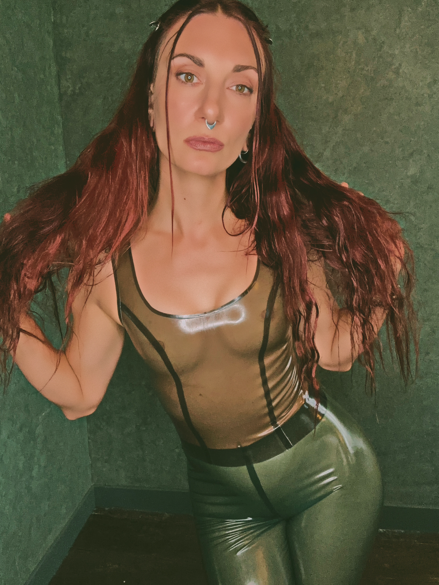 Detail of the contouring seams and close fit on the latex tank top