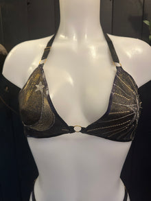 Close detail of the gold-plated adjustable hardware on the celestial latex bikini