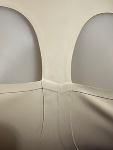 Detail of the white latex cup top showing its fitted shaped cups