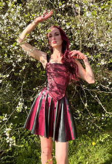 Detail of the fitted waist on the two-tone striped latex skater skirt