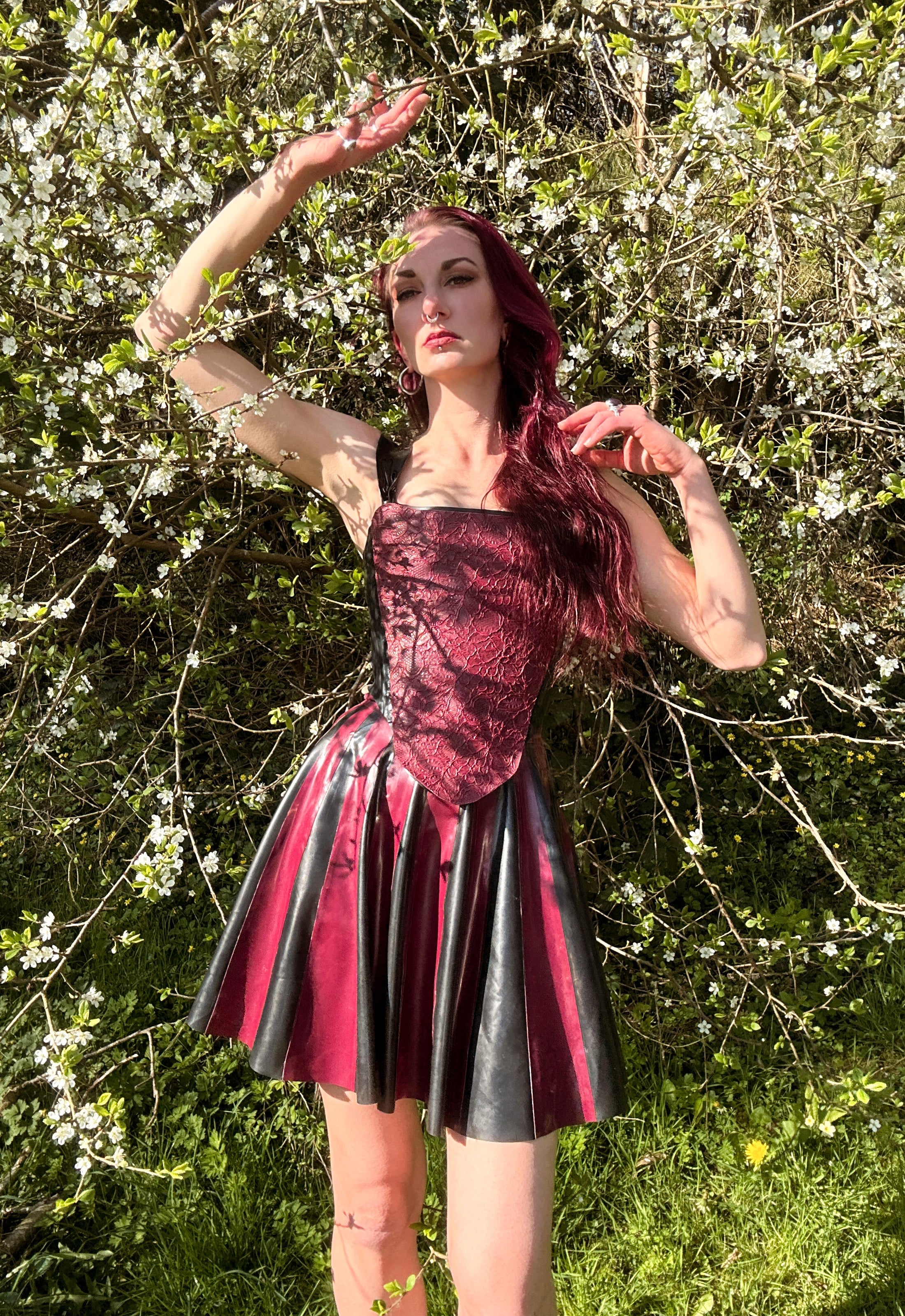 Detail of the fitted waist on the two-tone striped latex skater skirt