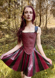 Styling of the striped latex skater skirt paired with a cropped top