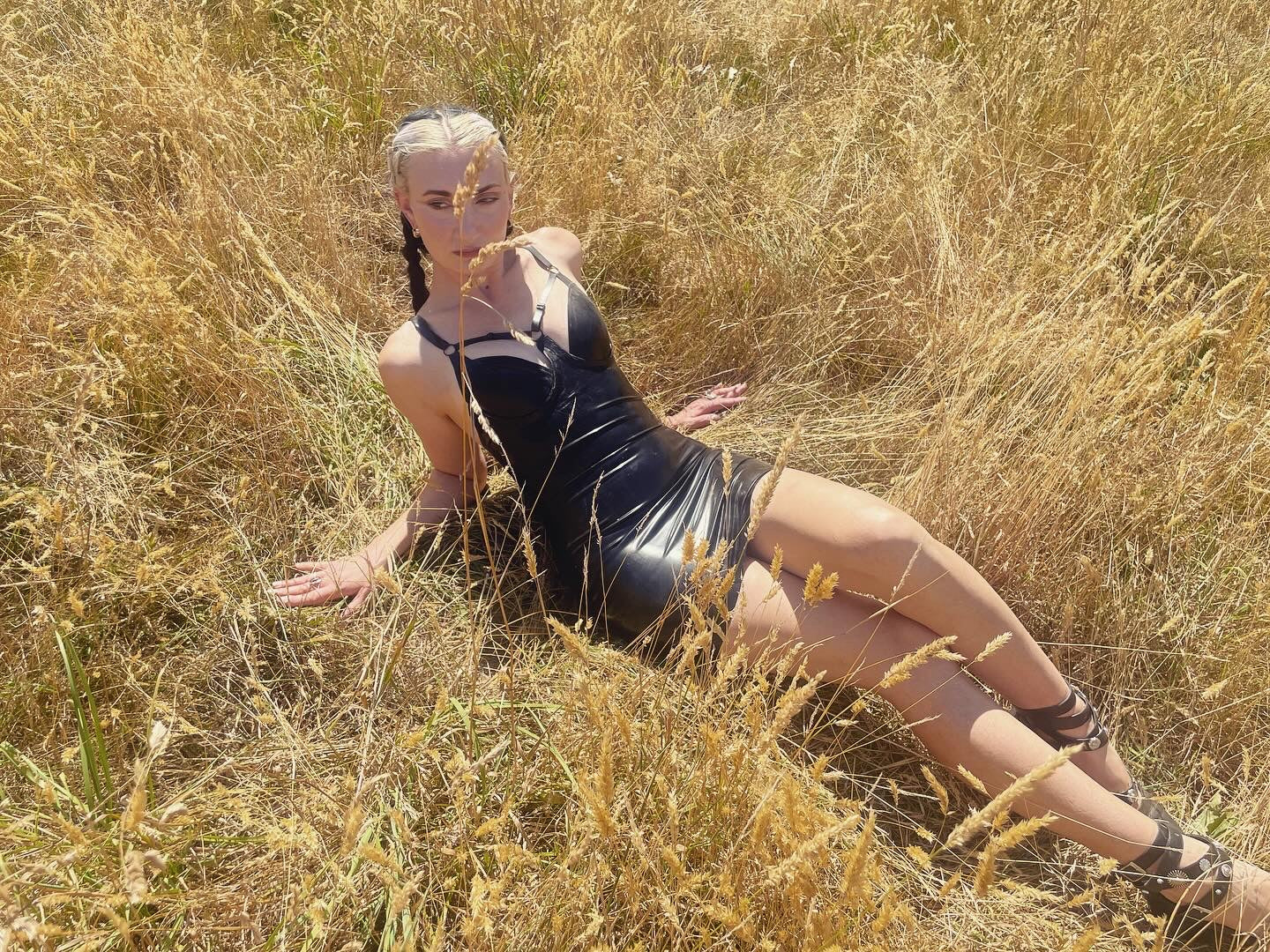 Styling of the mini latex harness dress with its harness detailing