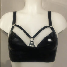 Close detail of the harness detailing on the underwired latex bra