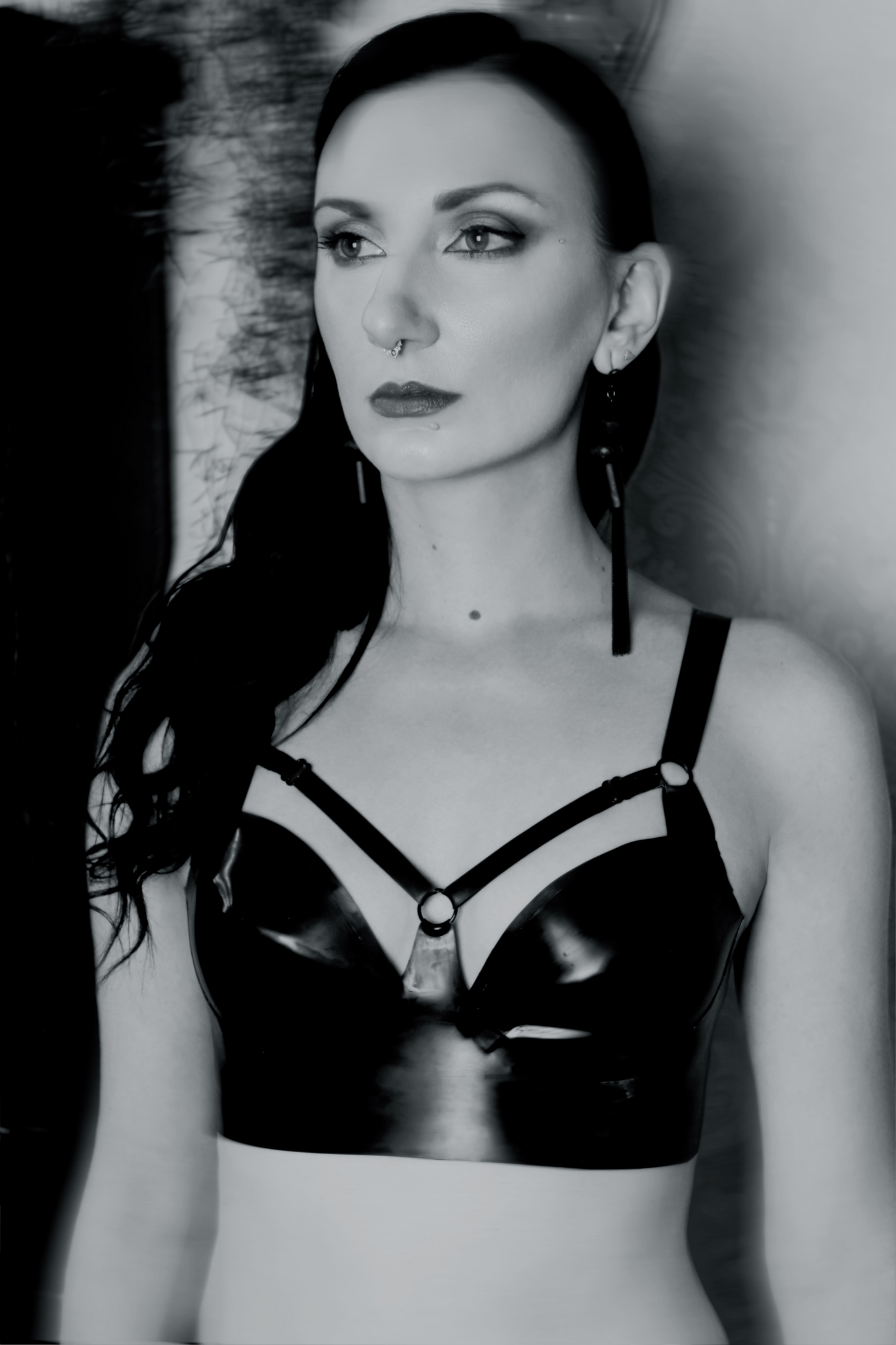 Eustratia underwired latex harness bra with adjustable straps across chest and back