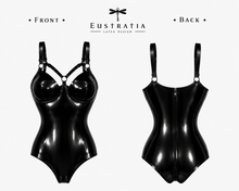 Styling of the latex harness bodysuit with its straight back and leg cut