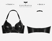 Detail of the centre back hook and eye fastening on the latex plunge halter bra