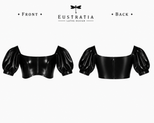Detail of the fitted latex bodice contouring the body on the Justice cropped top