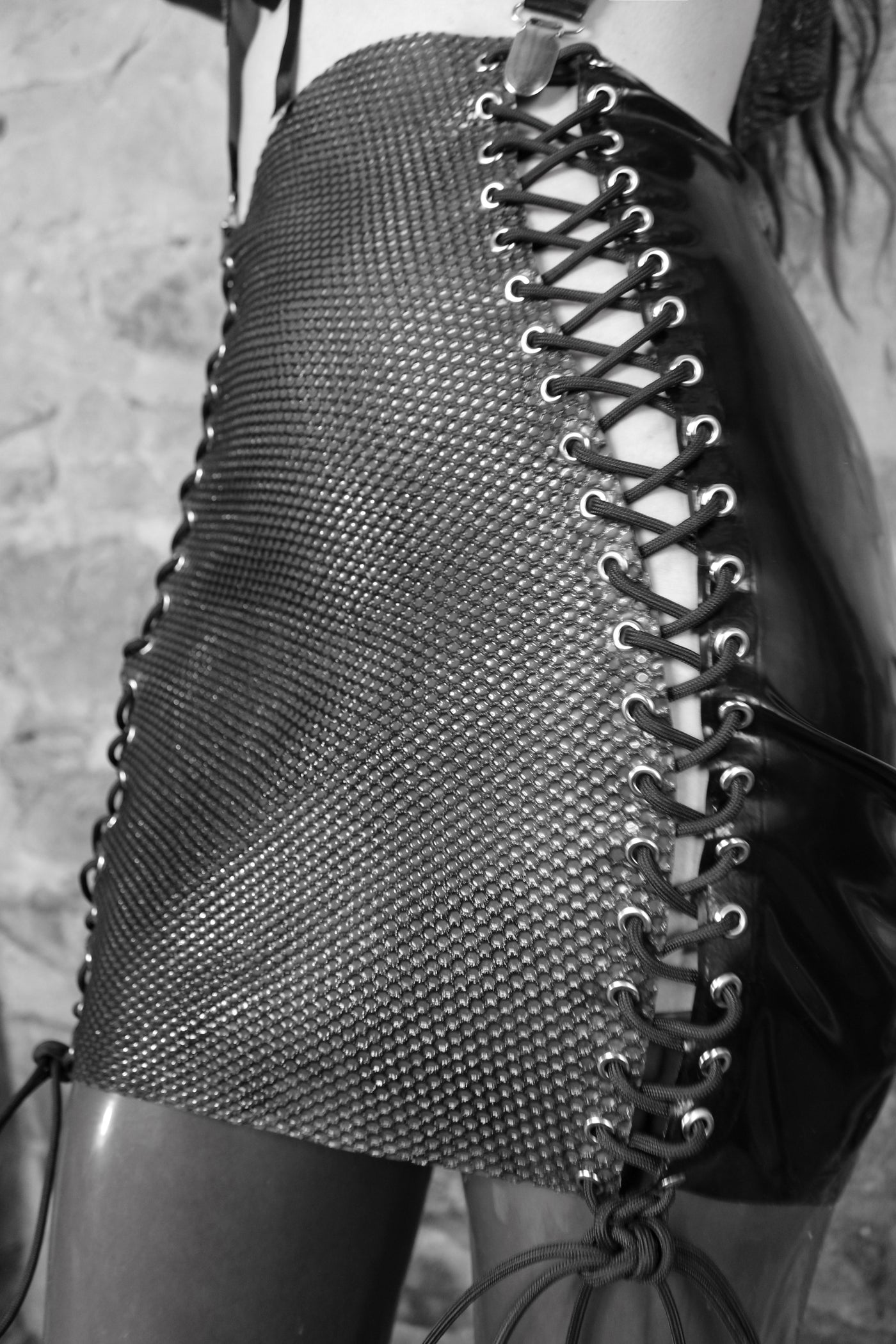 Eustratia latex-net panel for the lace-up skirt with textured black net and silver hardware