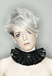 Close detail of the traditional pleating and hook and eye fastening on the latex ruff