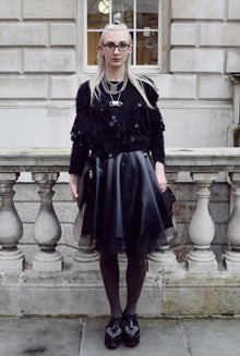 Styling of the floaty latex swing skirt showing its full swishing movement