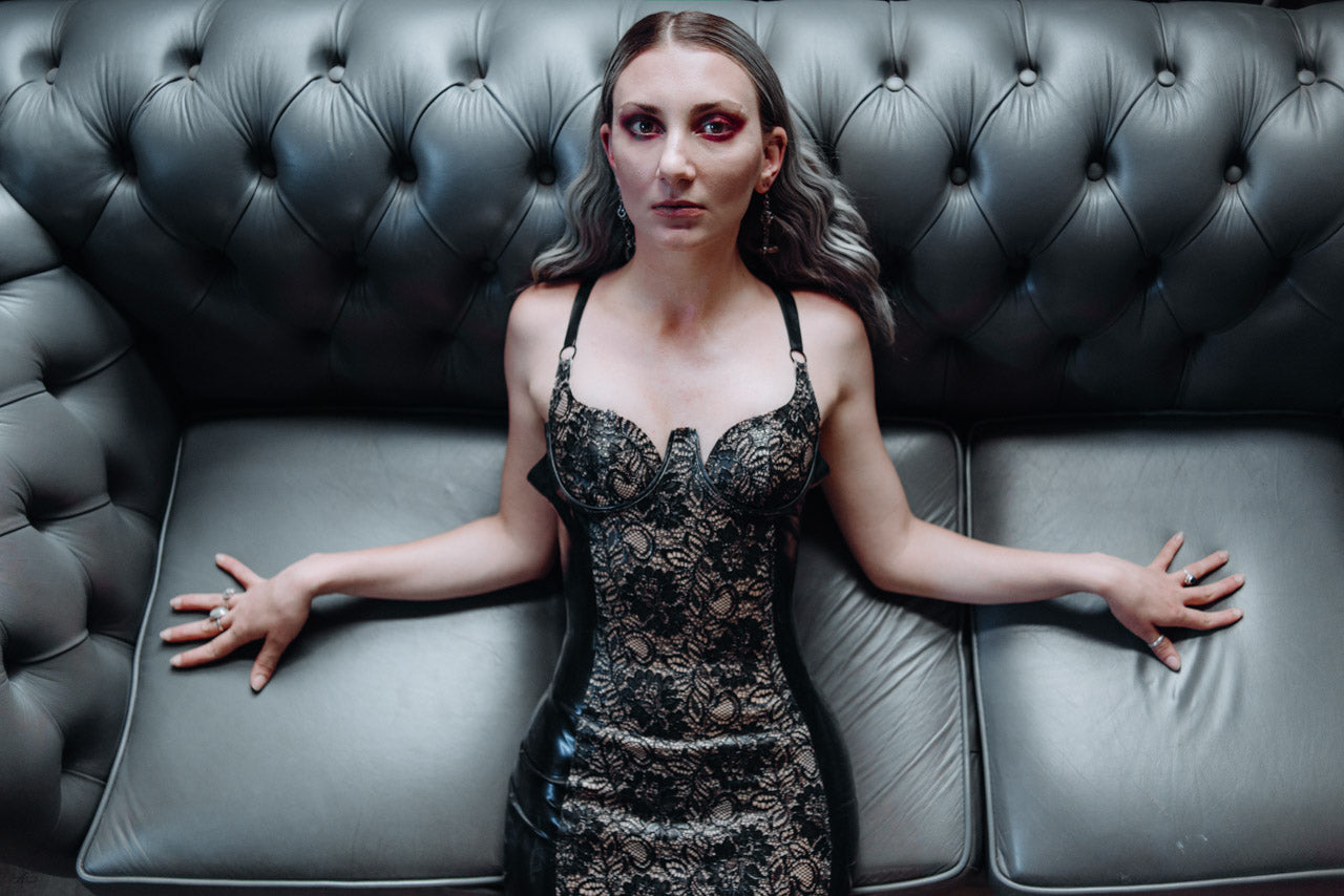 Styling of the low-back latex-lace panel dress with zip fastening