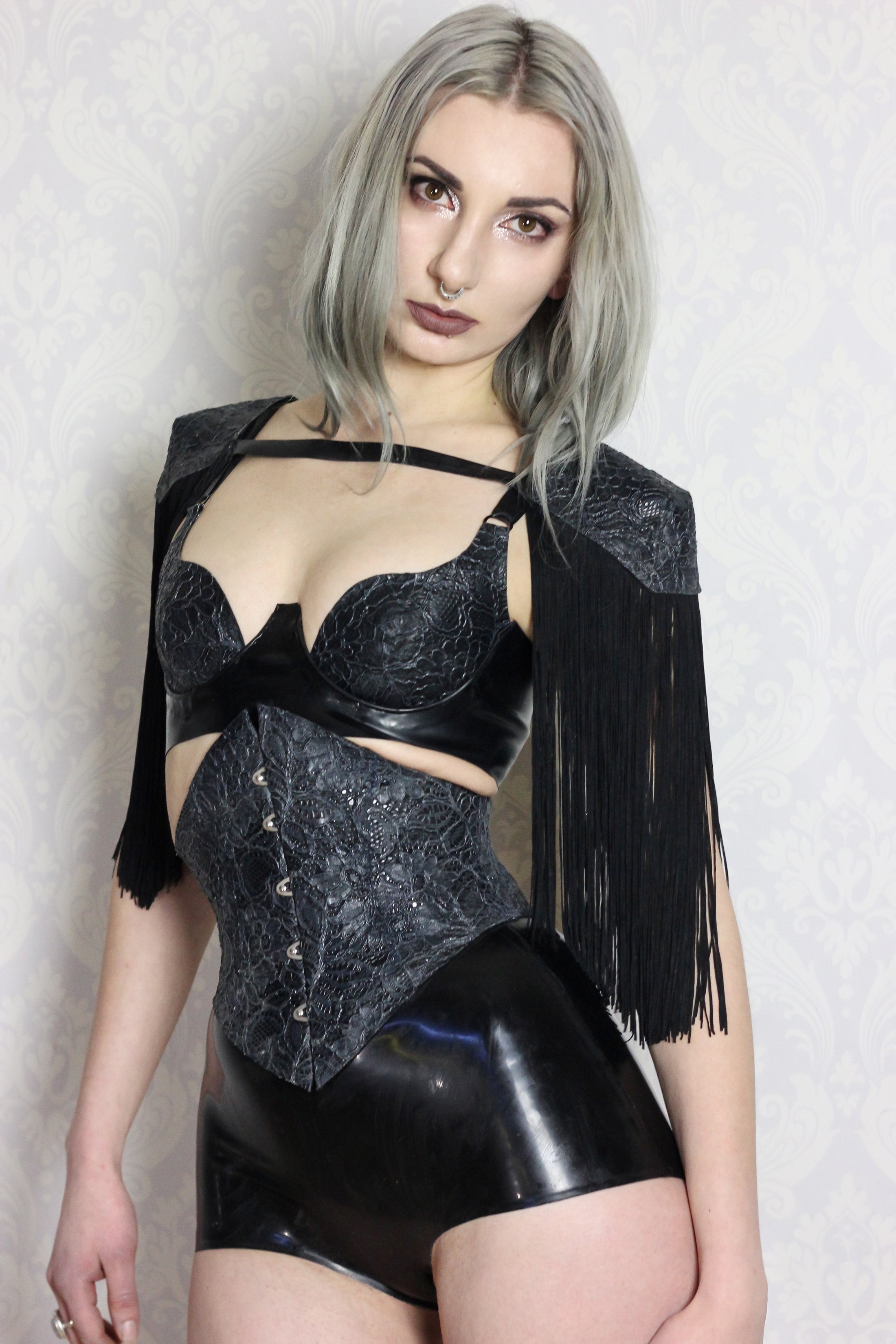 Styling of the shaped latex-lace corset with textured finish