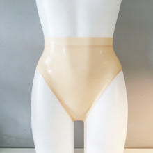 Fit of the high leg latex briefs in a soft translucent latex finish